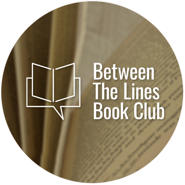 The pages of a book with the words ‘Between the lines book club’ written in white. 