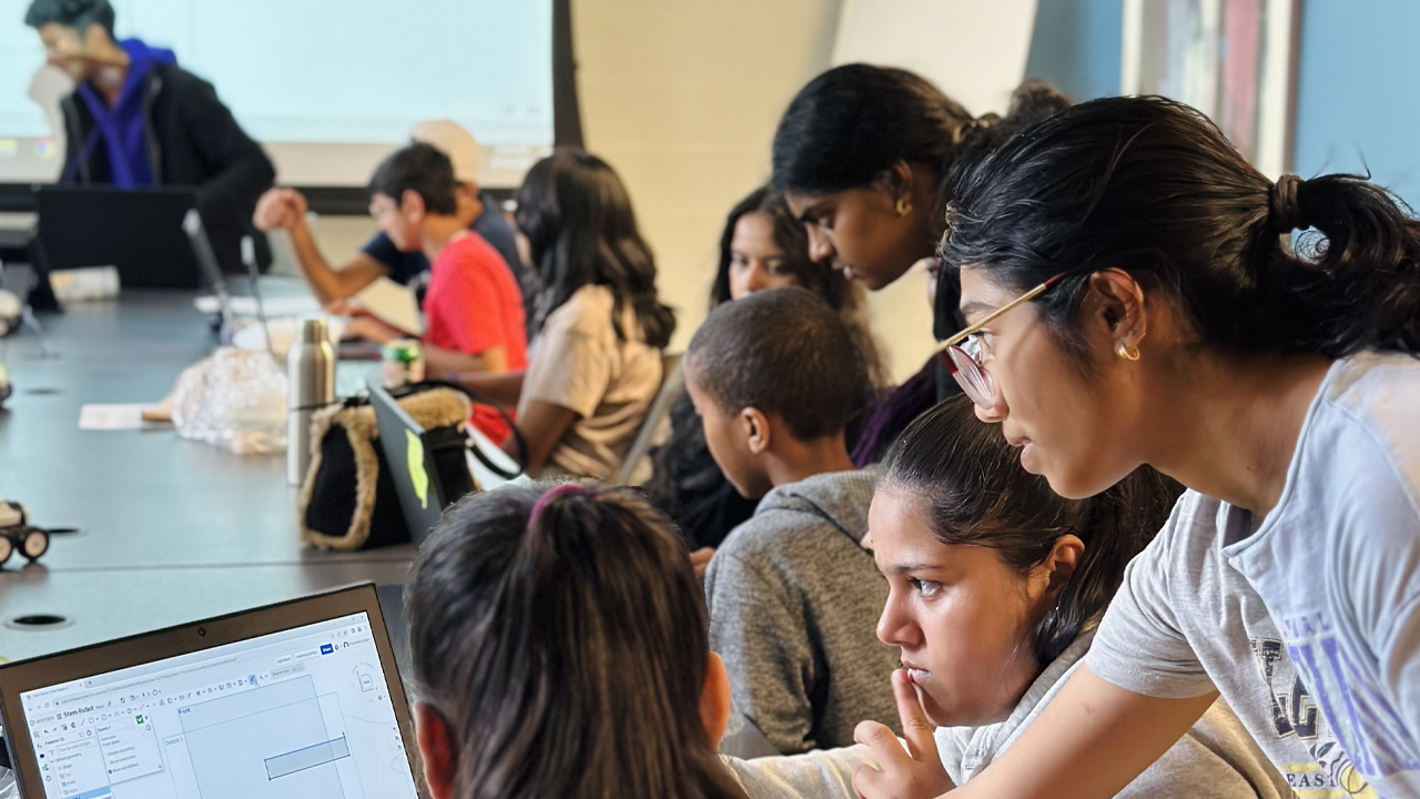 Students help one another at an after school program at a United Way Community Hub.