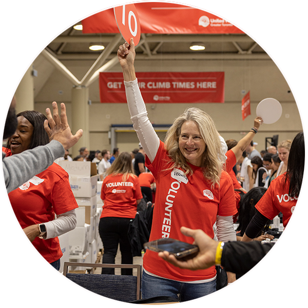 Volunteers high-fiving one another at United Way ClimbUP.