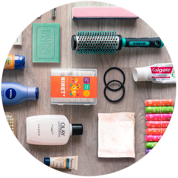 Various toiletries including a hairbrush and toothpaste. 